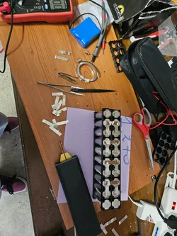 cutting nickel strips and preparing the spot welding